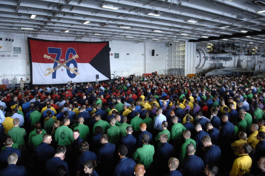 US Navy 090913-N-9818V-150 Sailors gather in the hangar bay of the aircraft carrier USS Ronald Reagan (CVN 76) for an all-hands call with Master Chief Petty Officer of the Navy (MCPON) Rick West