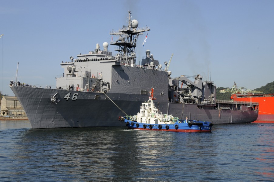US Navy 090924-N-8335D-320 A tug pulls the dock landing ship USS Tortuga (LSD 46) as she departs Sasebo