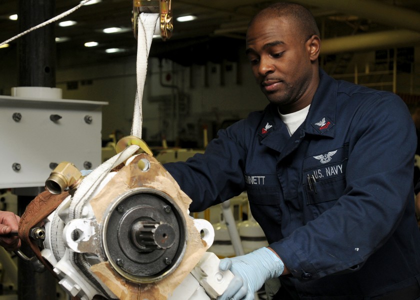 US Navy 100203-N-6688C-007 Sailor performs maintenance aboard USS Abraham Lincoln