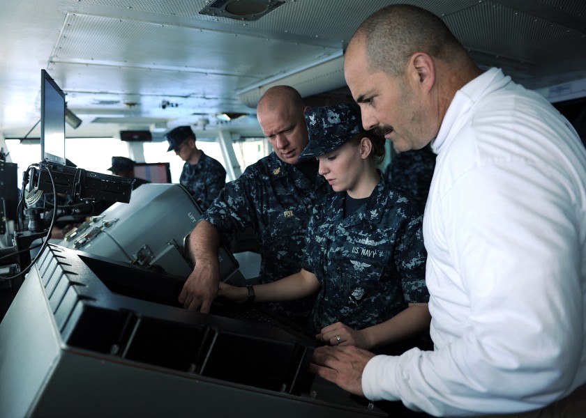 US Navy 100925-N-2821G-065 Senior Chief Quartermaster James Fox and Quartermaster 2nd Class Sarah DeGraw, explain surface contact radar aboard the 