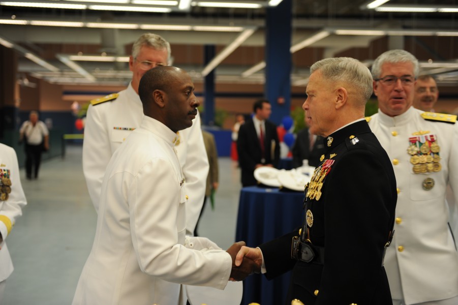 US Navy 101113-M-2581P-020 Gen. James F. Amos, right, shakes the hand of a U.S. Navy chief prior to the commissioning ceremony of USS Jason Dunham 