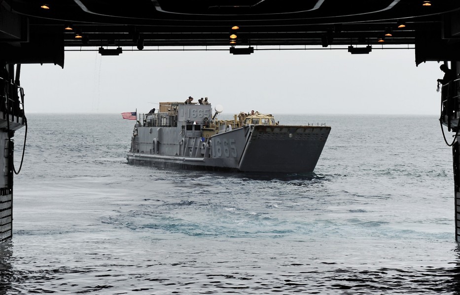 US Navy 110519-F-HS649-055 Landing Craft Utility (LCU) 1665 exits the well deck of the amphibious transport dock ship USS Cleveland (LPD 7) during 
