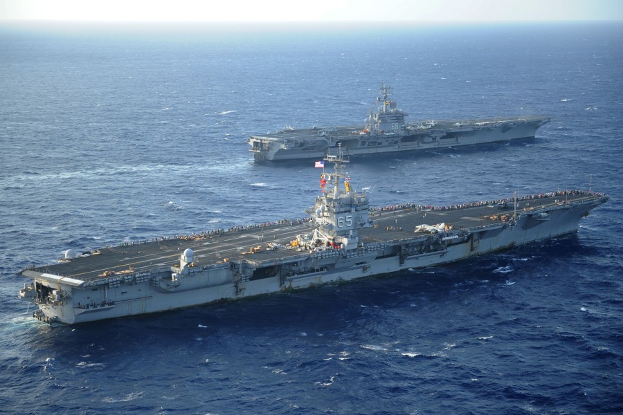 US Navy 110714-N-YC446-145 The aircraft carriers USS Enterprise (CVN 65) and USS Dwight D. Eisenhower (CVN 69) pass as Enterprise returns to homepo