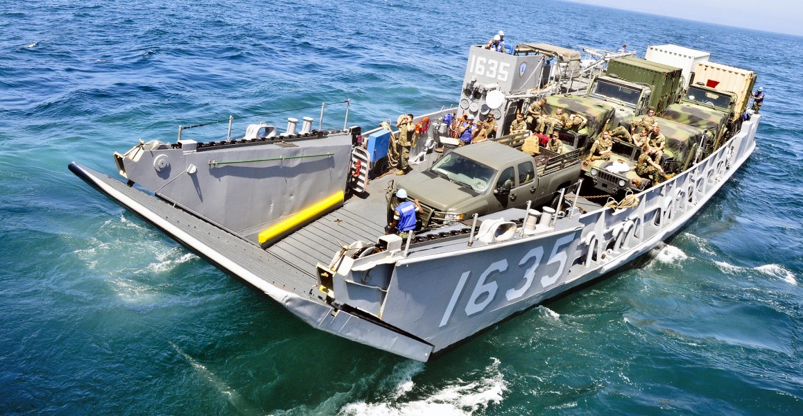 US Navy 110803-N-ZZ999-007 Landing Craft Utility (LCU) 1665 departs the well deck of the amphibious transport dock ship USS Cleveland (LPD 7)
