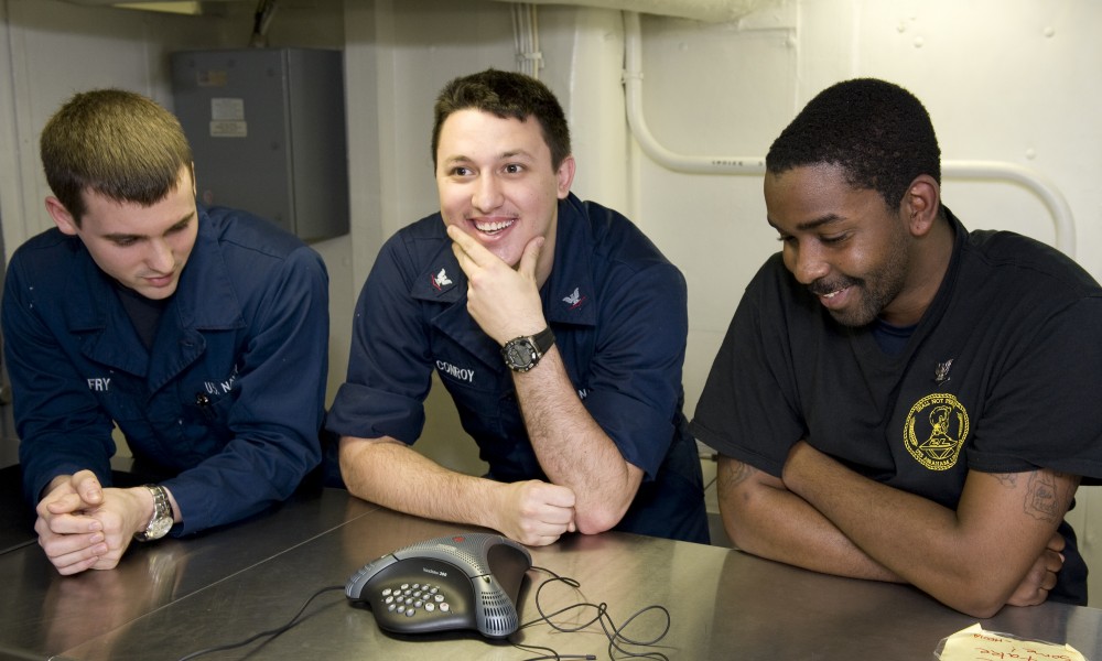 US Navy 111219-N-VO377-042 Sailors talk to New Orleans Saints tight-end Jimmy Graham during a holiday morale phone call aboard the Nimitz-Class air