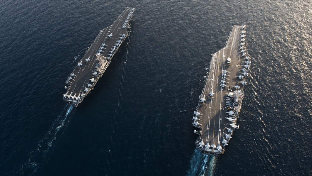 US Navy 120119-N-OY799-094 The Nimitz-class aircraft carriers USS John C. Stennis (CVN 74) and USS Abraham Lincoln (CVN 72) transit during a turnov