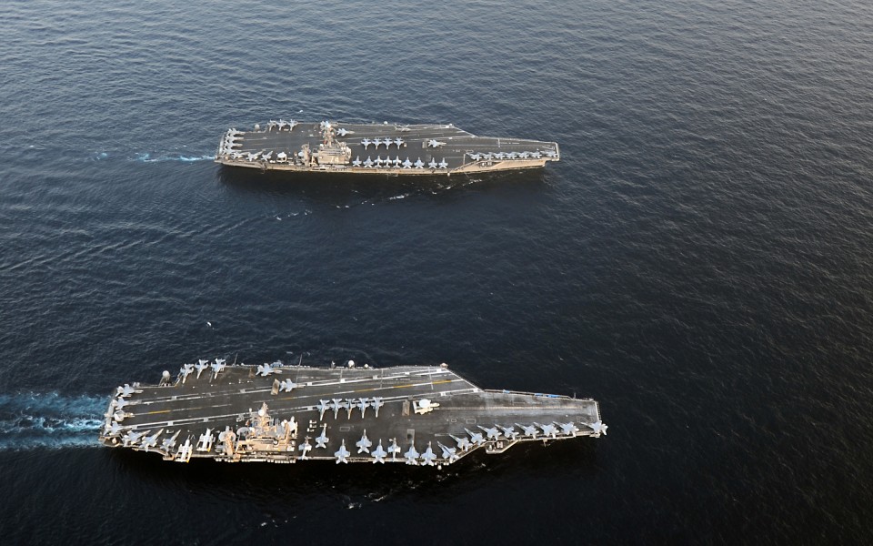 US Navy 120119-N-QH883-124 The Nimitz-class aircraft carriers USS Abraham Lincoln (CVN 72) and USS John C. Stennis (CVN 74) join for a turnover of 
