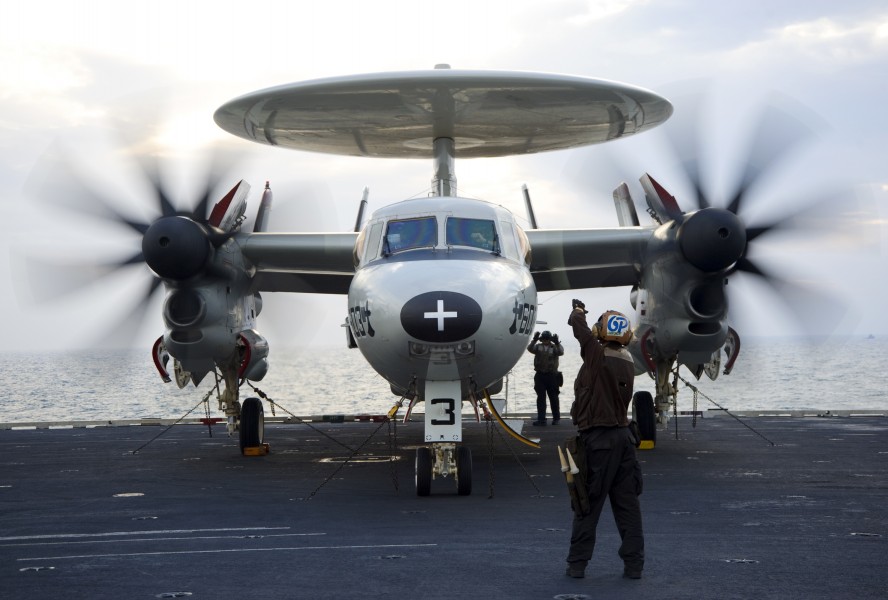 US Navy 120213-N-JN664-083 A plane captain relays hand signals between maintainers and pilots of an E-2C Hawkeye assigned to the Sun Kings of Airbo
