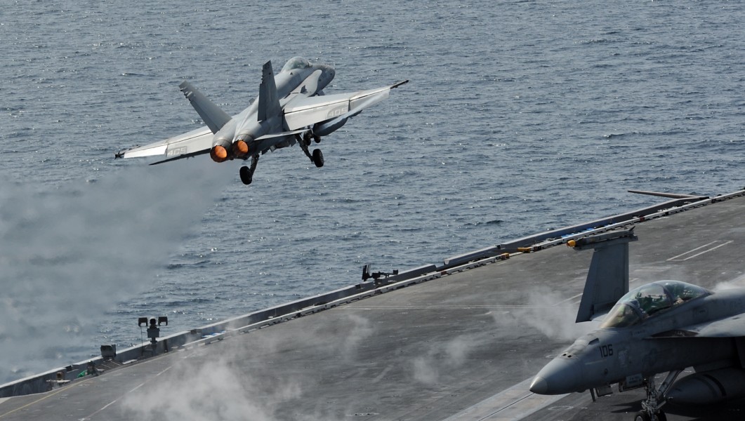 US Navy 120216-N-VO377-376 An F-A-18C Hornet assigned to the Blue Blasters of Strike Fighter Squadron (VFA) 34 launches from the flight deck of the