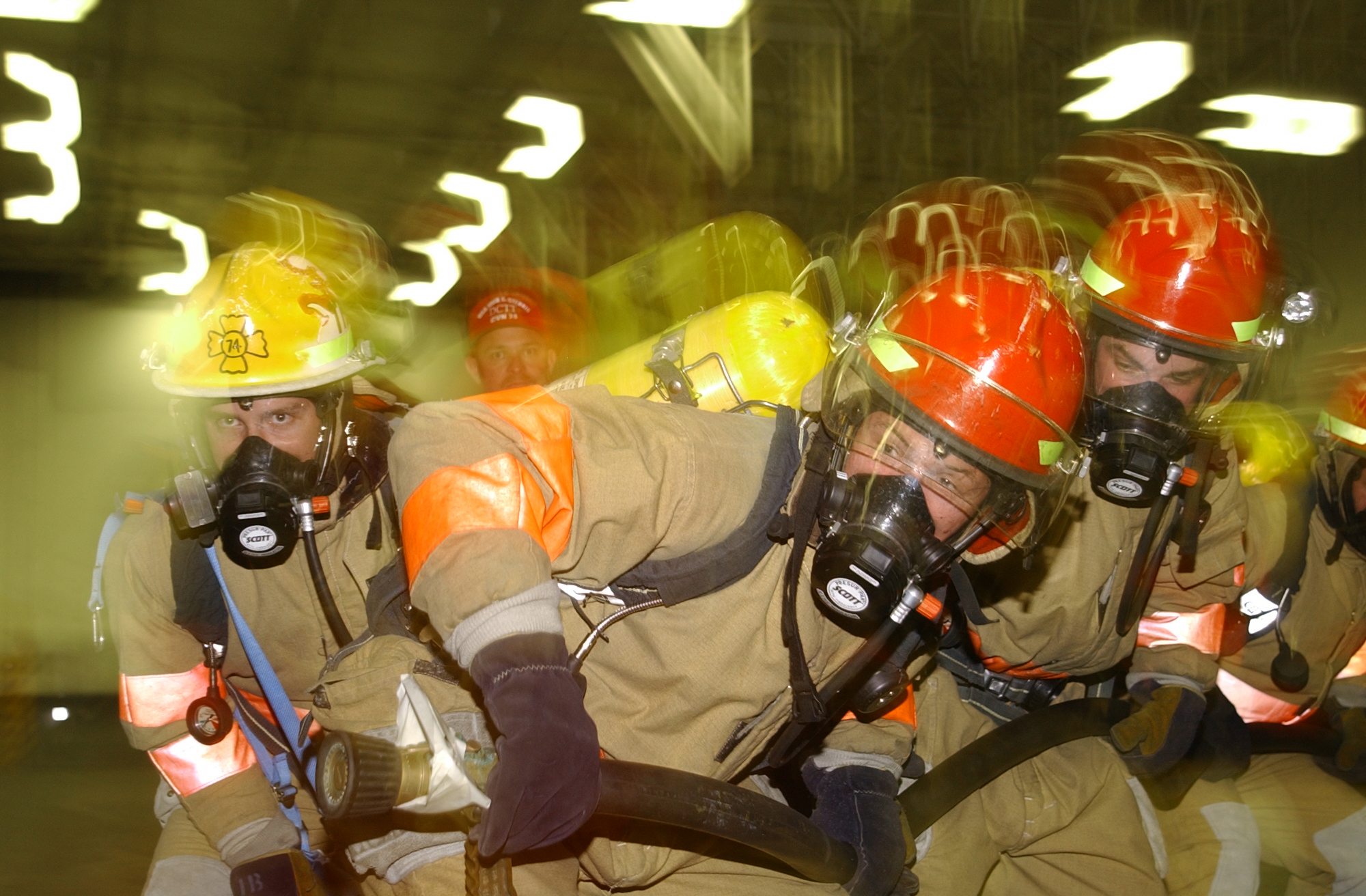 US Navy 030616-N-9769P-019 A damage control fire team battles a simulated fire