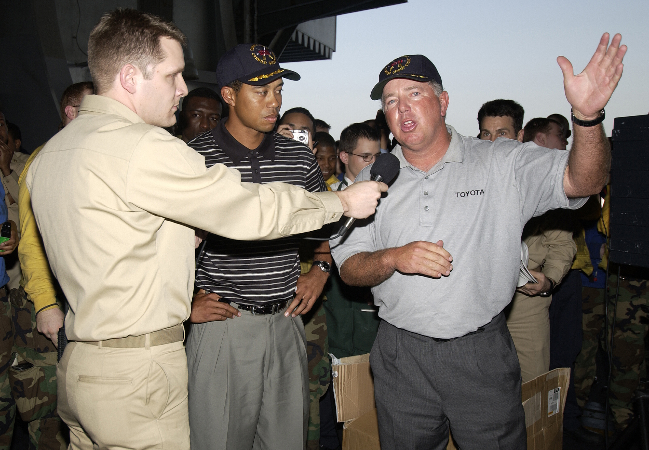 US Navy 040303-N-5319A-004 Professional golfers Tiger Woods and Mark O'Mara speak to the crew in the hanger bay of the nuclear powered aircraft carrier USS George Washington (CVN 73)