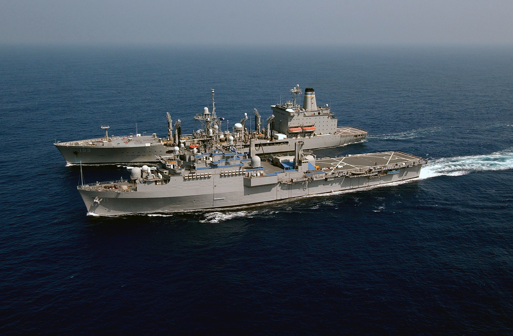 US Navy 040420-N-9849W-285 The command ship USS Coronado (AGF 11) pulls alongside the Military Command Ship (MSC) underway replenishment oiler USNS Tippecanoe (T-AO 199)