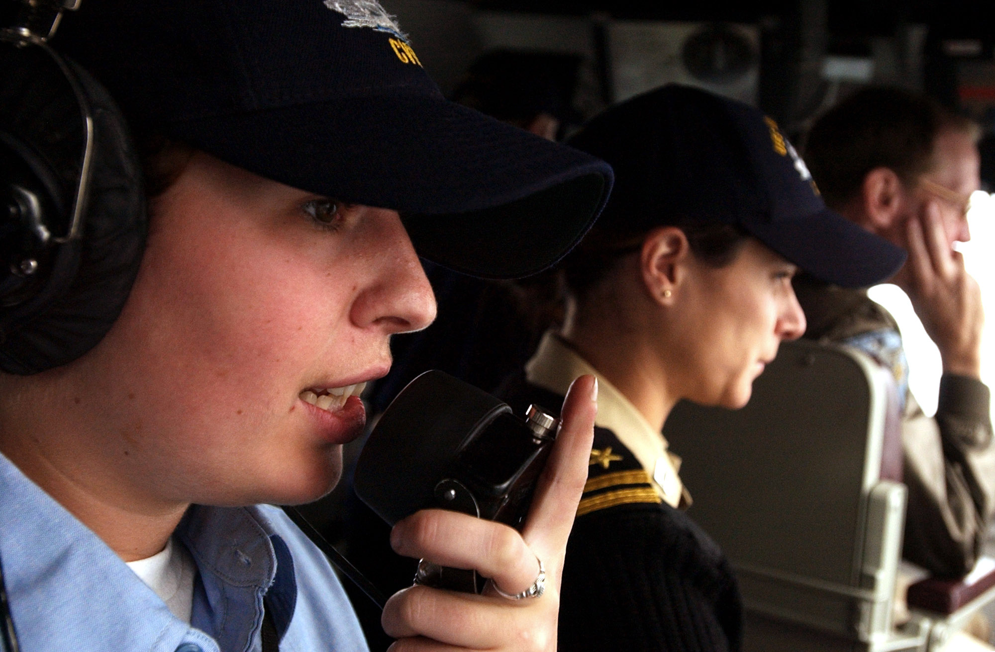 US Navy 050726-N-5549O-097 Station to station phone talker, Seaman Ariane Ellis, left, communicates with the guided-missile destroyer USS Decatur (DDG 73)