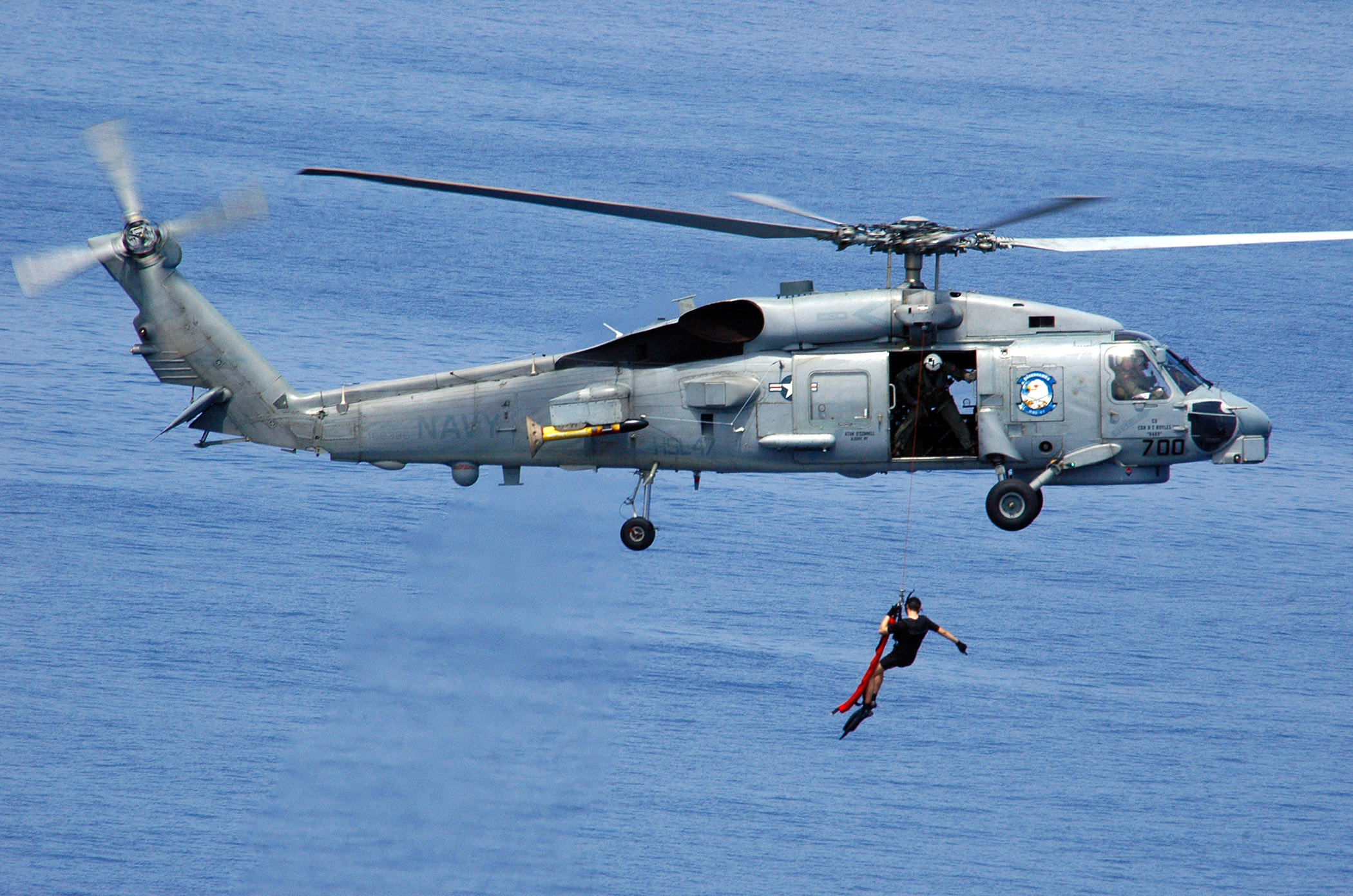 US Navy 060417-N-9079D-095 An SH-60B Seahawk helicopter assigned to Helicopter Anti-Submarine Squadron Light Four Seven (HSL-47) deploys a search and rescue swimmer