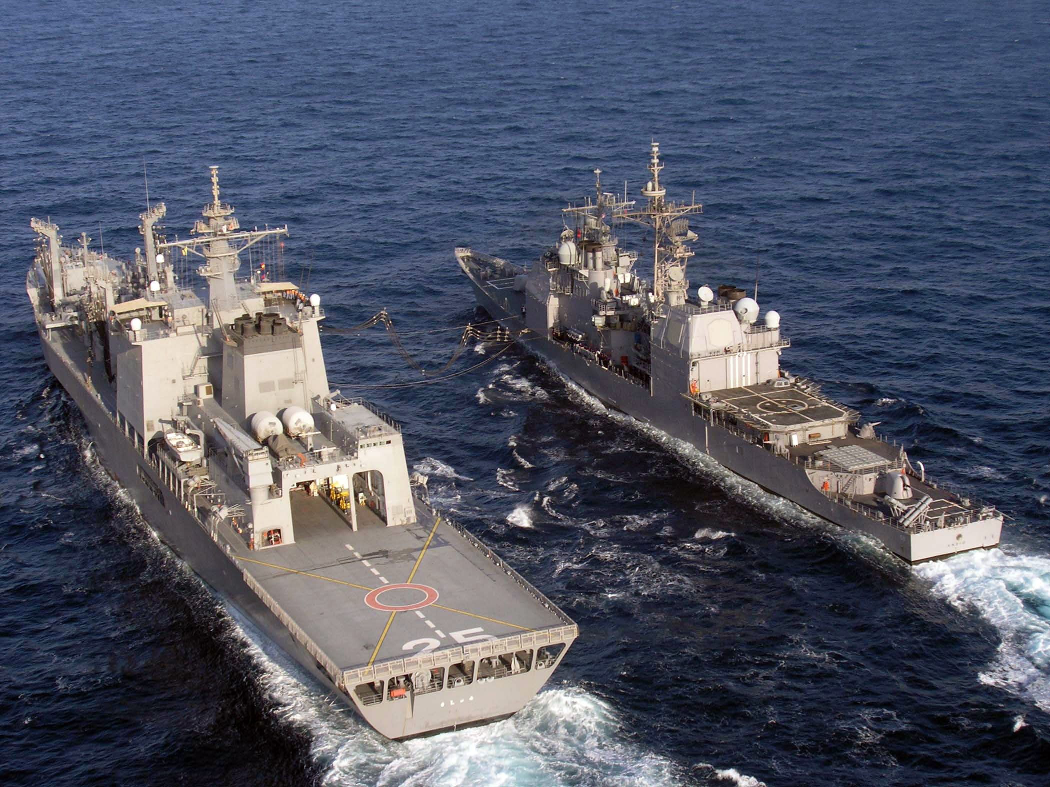 US Navy 061122-N-8036C-215 The Japanese fast combat support ship JDS Mashu (AOE 425) conducts a replenishment at sea (RAS) with the guided-missile cruiser USS Anzio (CG 68)