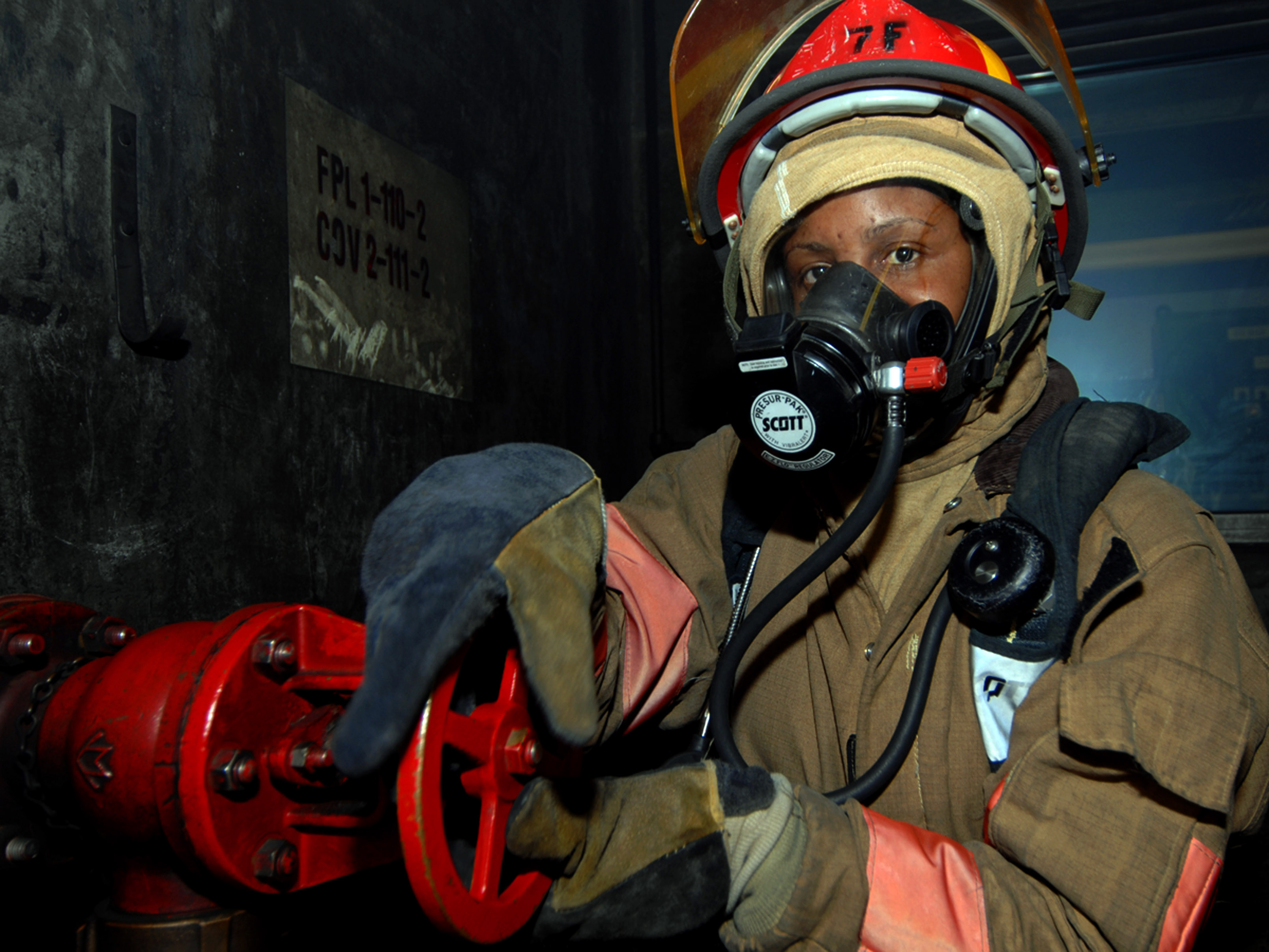 US Navy 070627-N-4868G-166 A damage controlman from USS Harry S. Truman (CVN 75) participates in an event at the 5th Annual Damage Control (DC) Olympics at the Farrier Firefighting School
