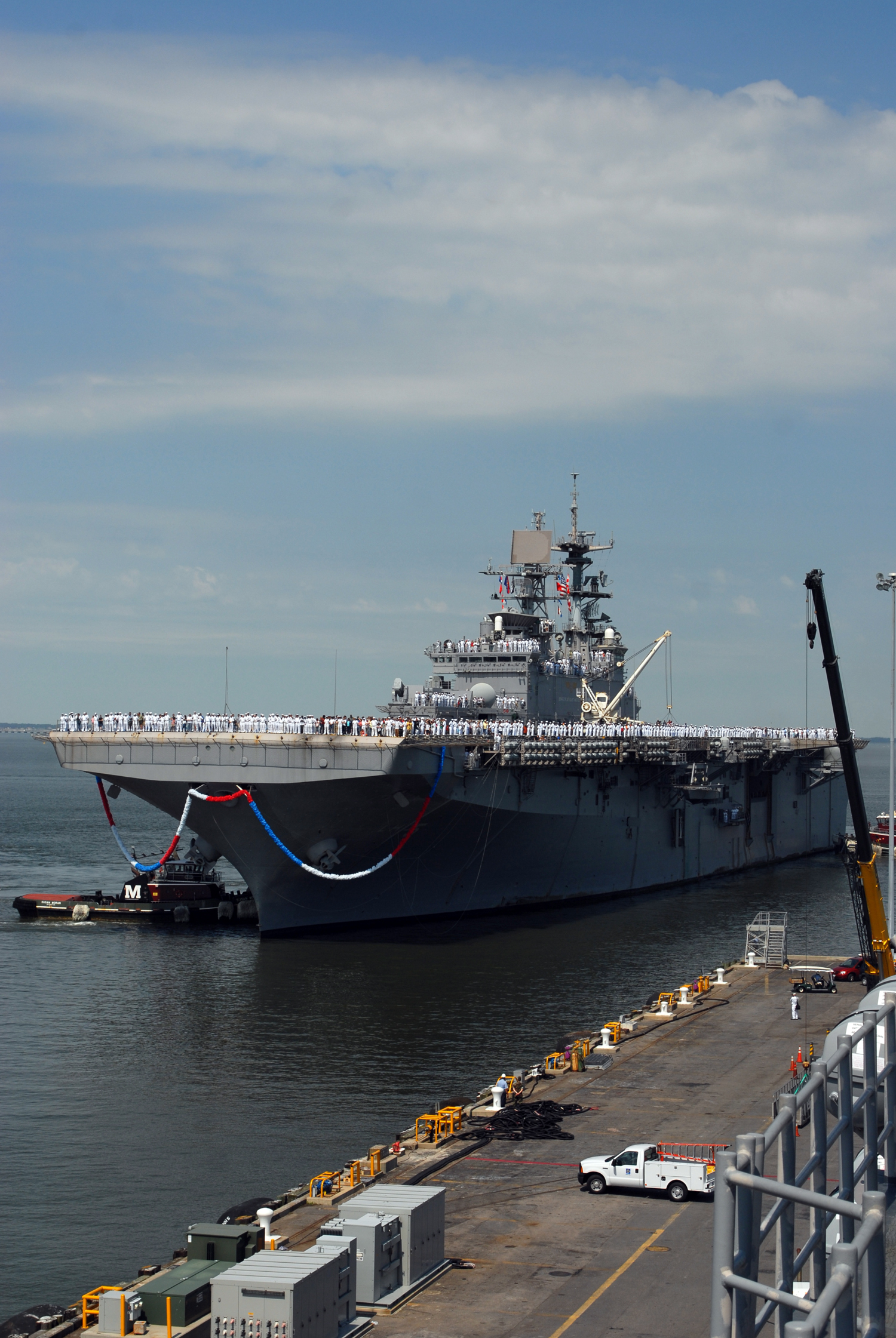 US Navy 070703-N-0841E-004 Sailors and Marines assigned to amphibious assault ship USS Bataan (LHD 5) return to Naval Station Norfolk after completing a scheduled six-month deployment