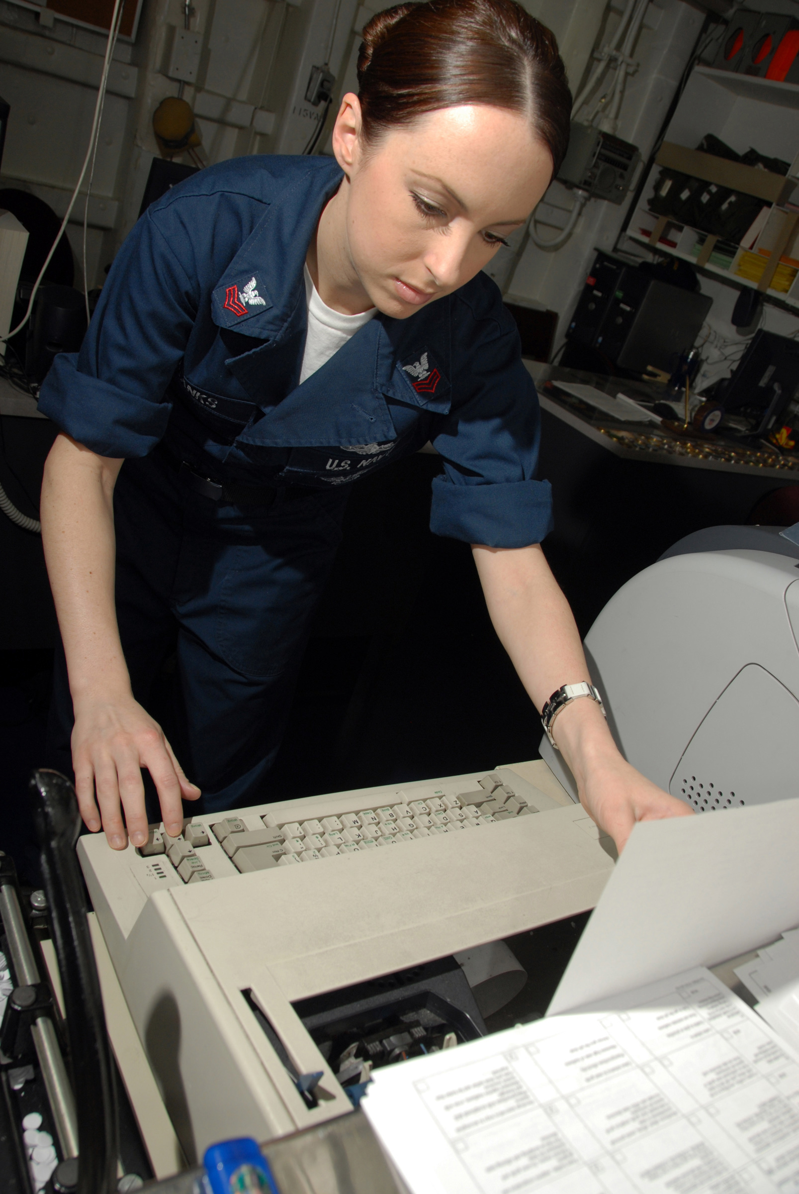 US Navy 080711-N-9450M-018 Yeoman 1st Class Julie Eubanks, of Rockwall, Texas, types an enclosure letter in the administrative office aboard the Nimitz-class aircraft carrier USS Abraham Lincoln (CVN 72)