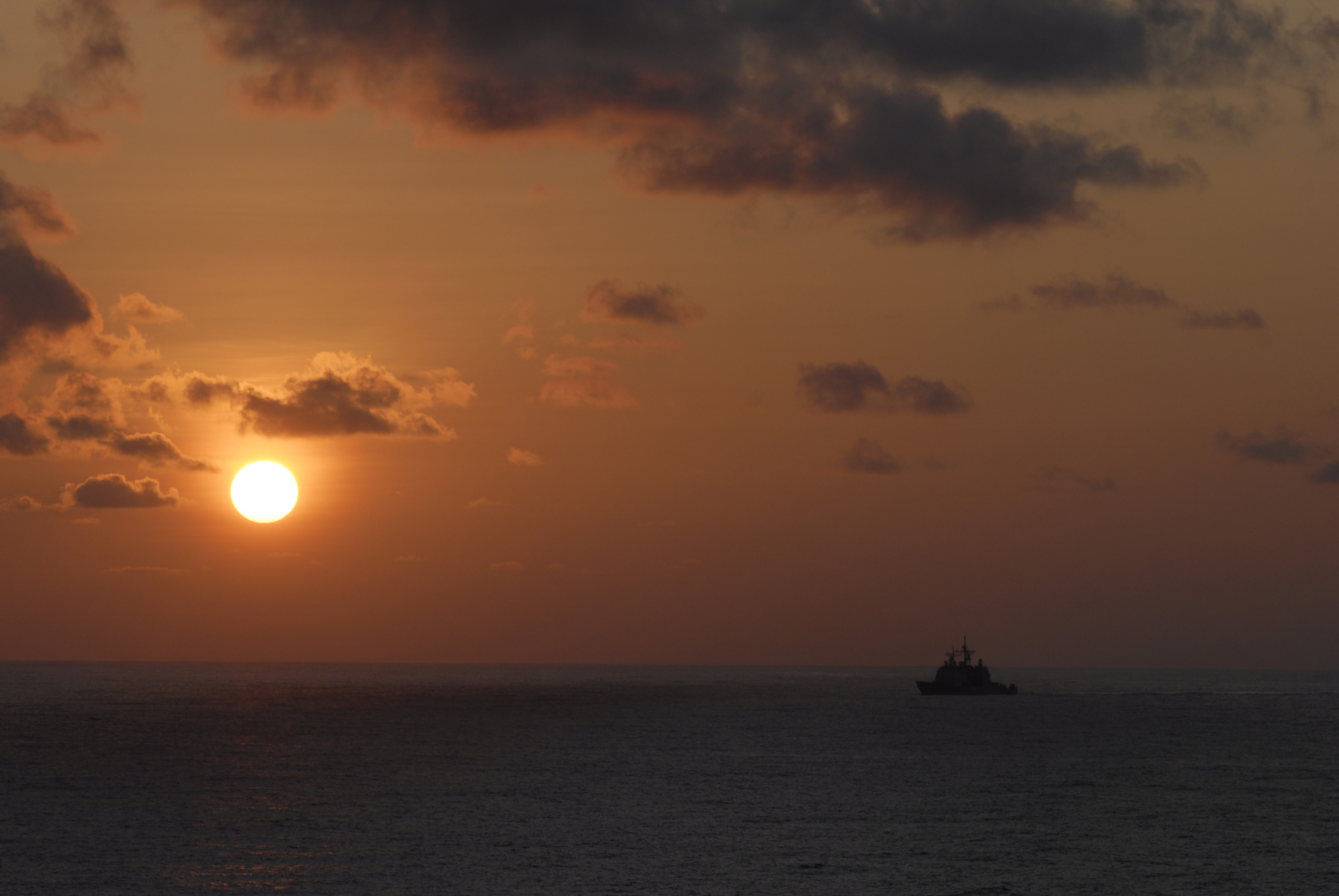 US Navy 090324-N-8157C-097 The Ticonderoga-class guided-missile cruiser USS Antietam (CG 54) transits through the ocean at sunset