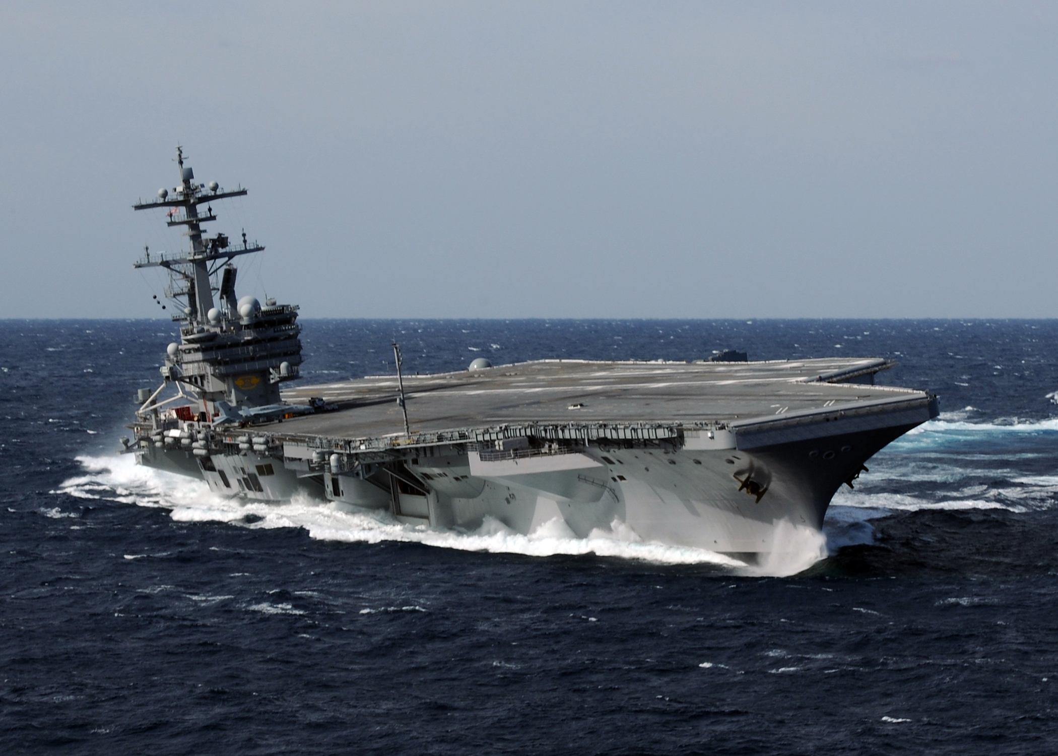 US Navy 100227-N-4408B-613 USS George H.W. Bush (CVN 77) heels hard to starboard during high-speed drills