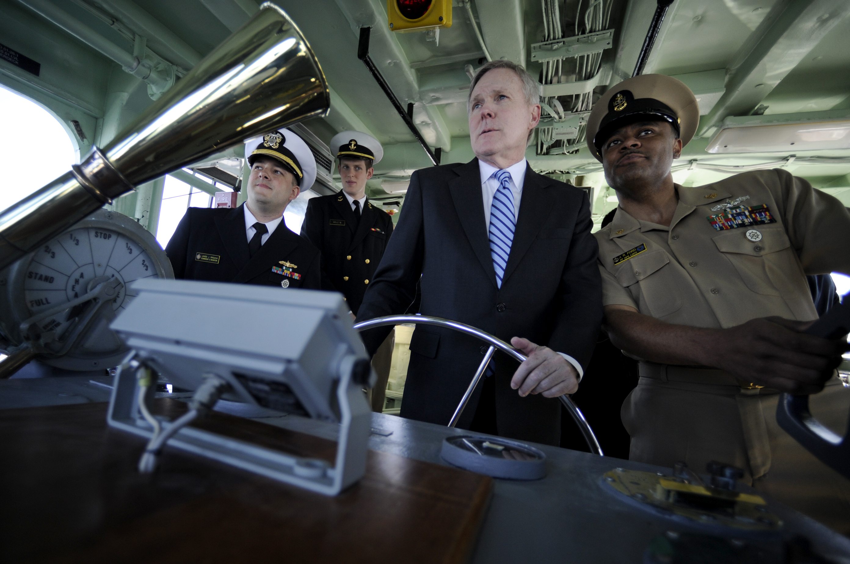 US Navy 100308-N-5549O-175 Secretary of the Navy (SECNAV) the Honorable Ray Mabus receives navigation instruction while taking the helm of a yard patrol craft at the U.S. Naval Academy