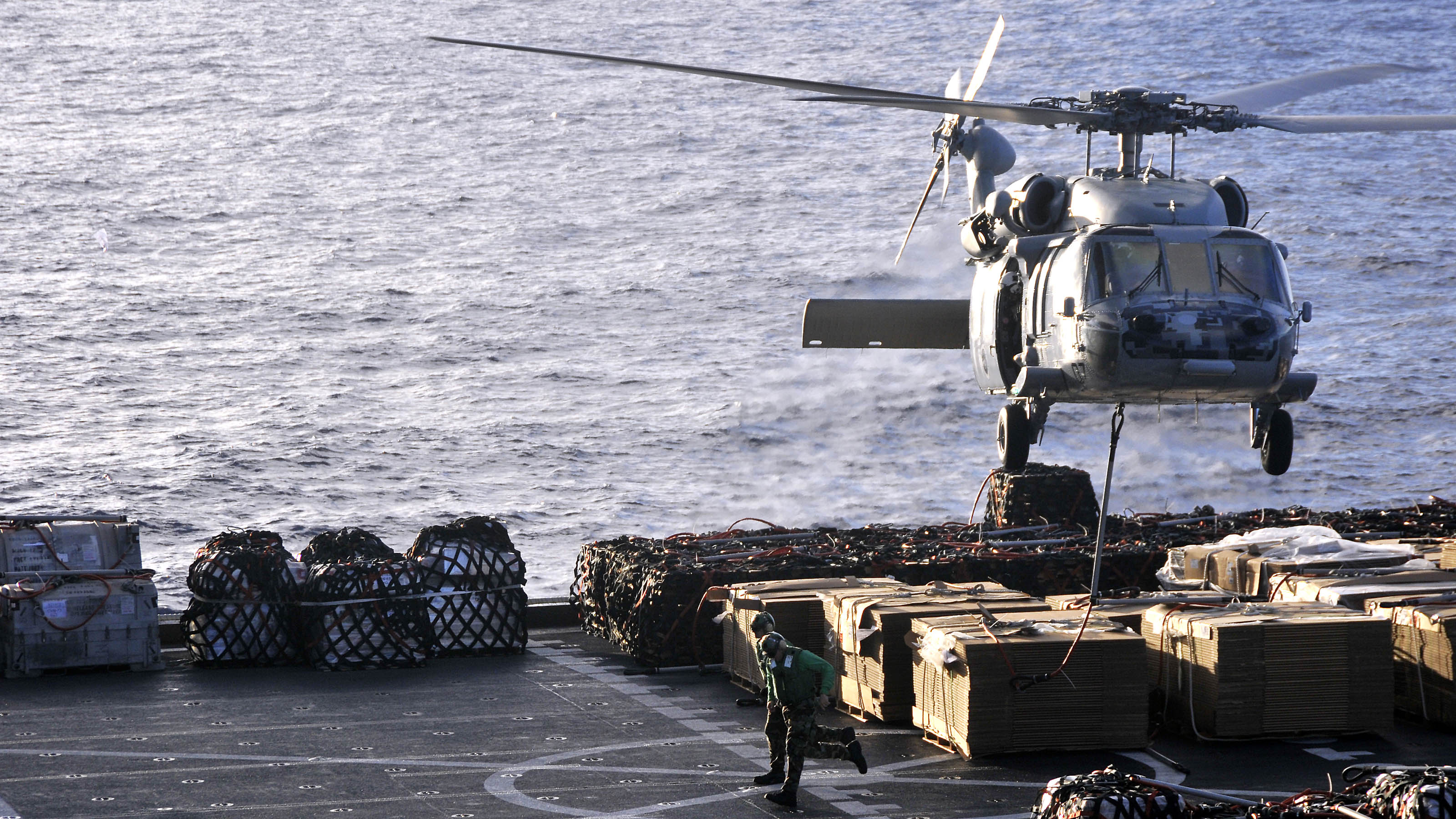US Navy 101025-N-7103C-076 An MH-60S Sea Hawk helicopter assigned to the Island Knights of Helicopter Sea Combat Squadron (HSC) 25 lifts cargo from