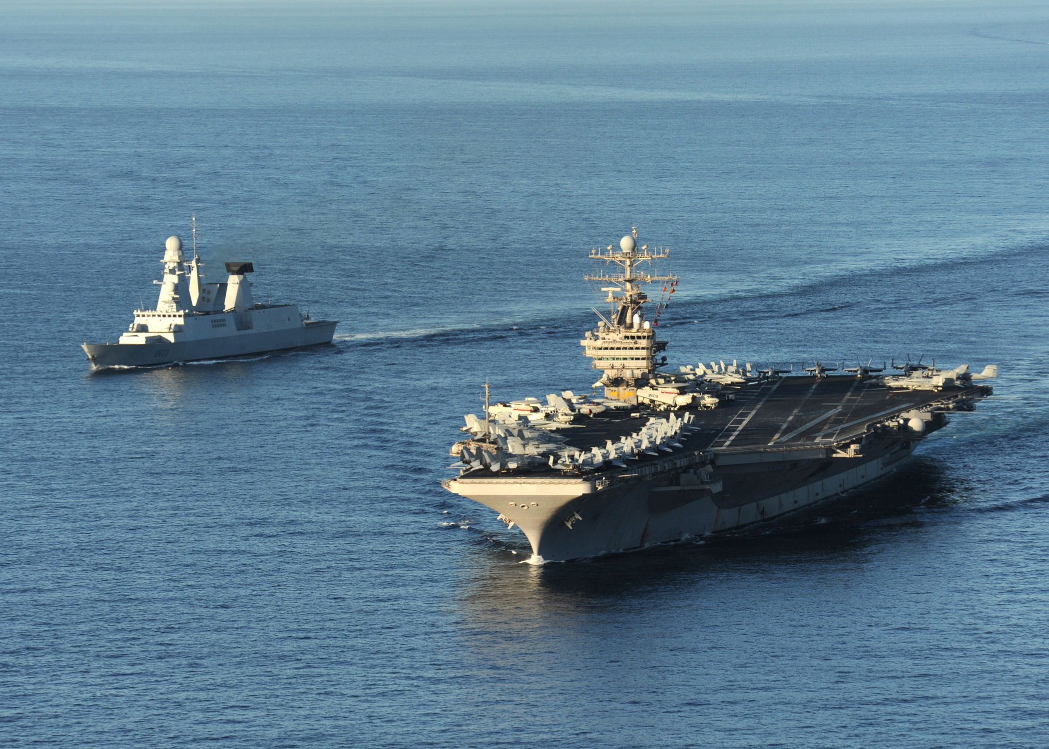 US Navy 101210-N-1261P-007 The aircraft carrier USS Abraham Lincoln (CVN 72), right, and the French navy destroyer Forbin (D 620) are underway toge