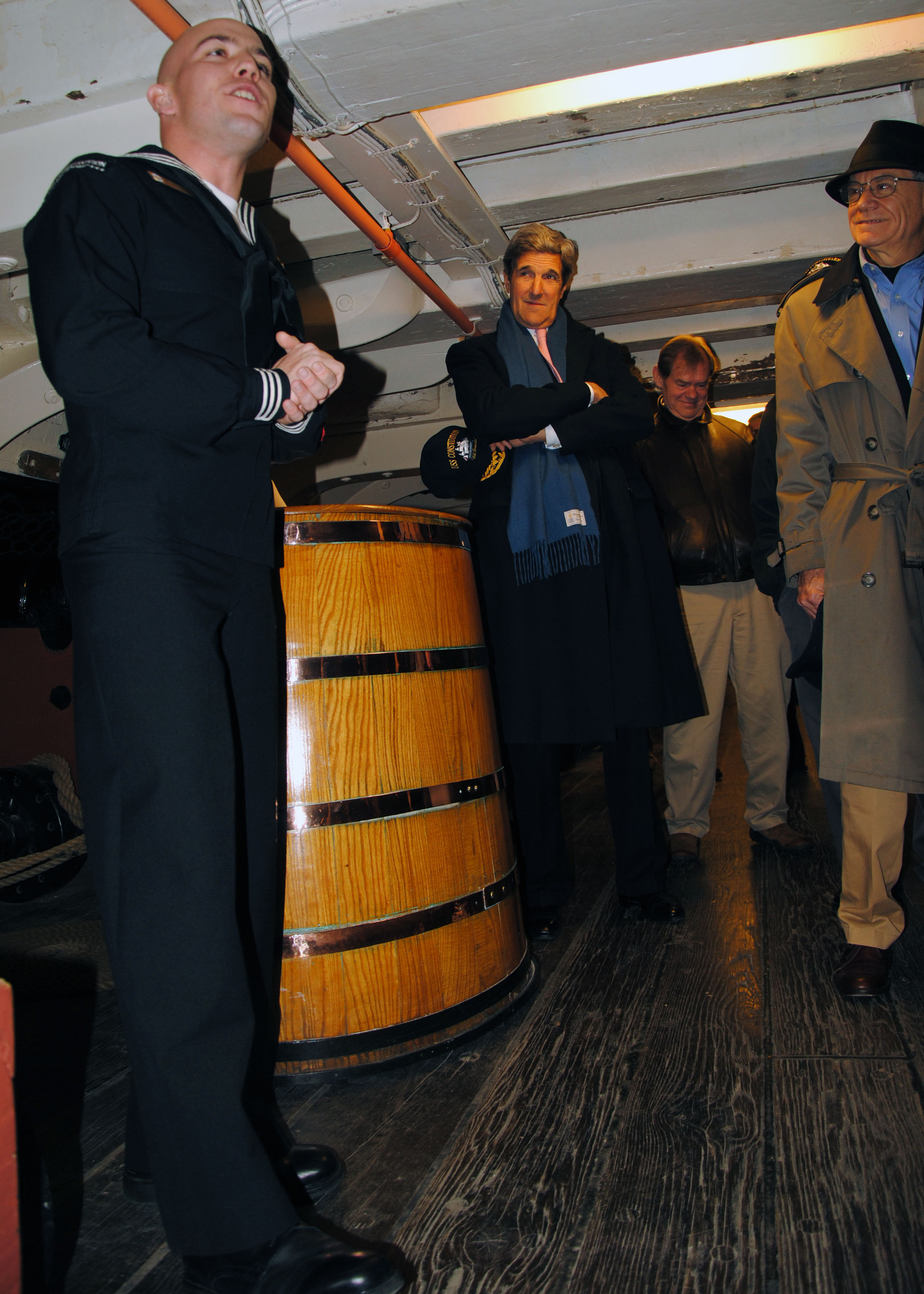US Navy 101214-N-7642M-145 Boatswain's Mate 2nd Class Philip Gagnon gives a tour of USS Constitution to U.S. Senator John Kerry