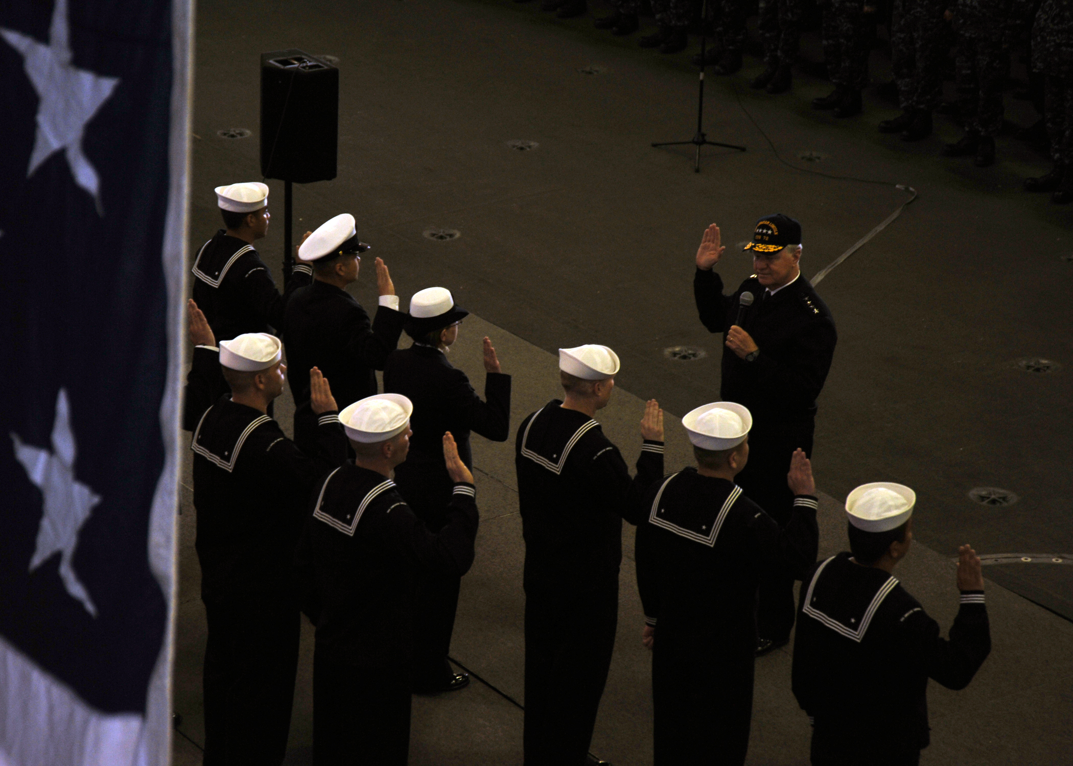 US Navy 110510-N-YB753-024 Chief of Naval Operations (CNO) Adm. Gary Roughead administers the oath of enlistment to ten Sailors aboard USS Abraham 