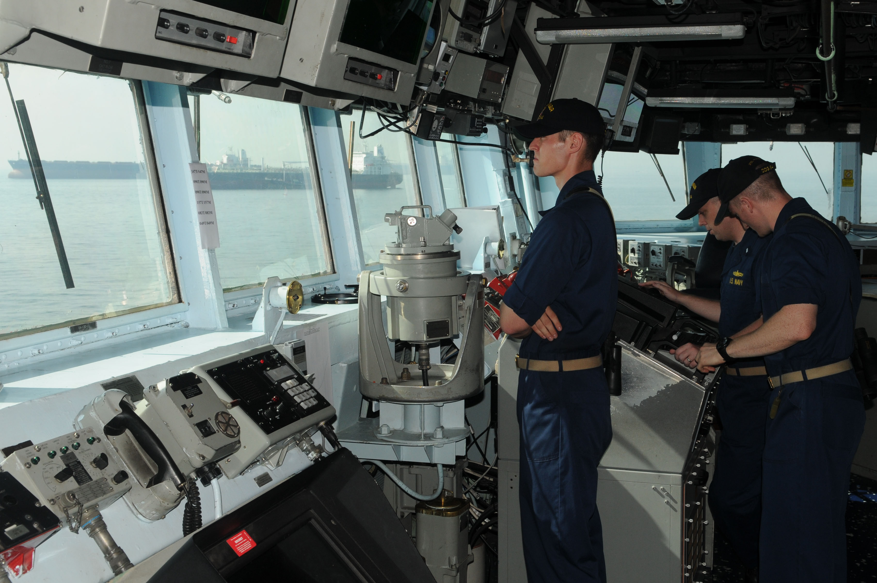 US Navy 110821-N-IO627-008 Sailors stand watch on the bridge of the USS Curtis Wilbur
