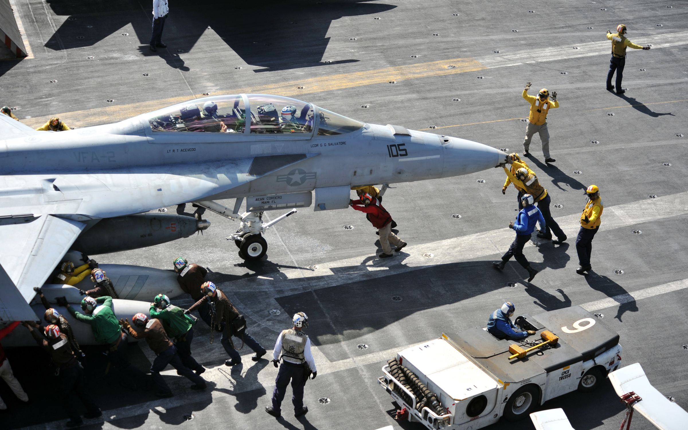 US Navy 111006-N-YB753-004 Sailors push back an F-A-18F Super Hornet assigned to the Bounty Hunters of Strike Fighter Squadron (VFA) 2 on the fligh