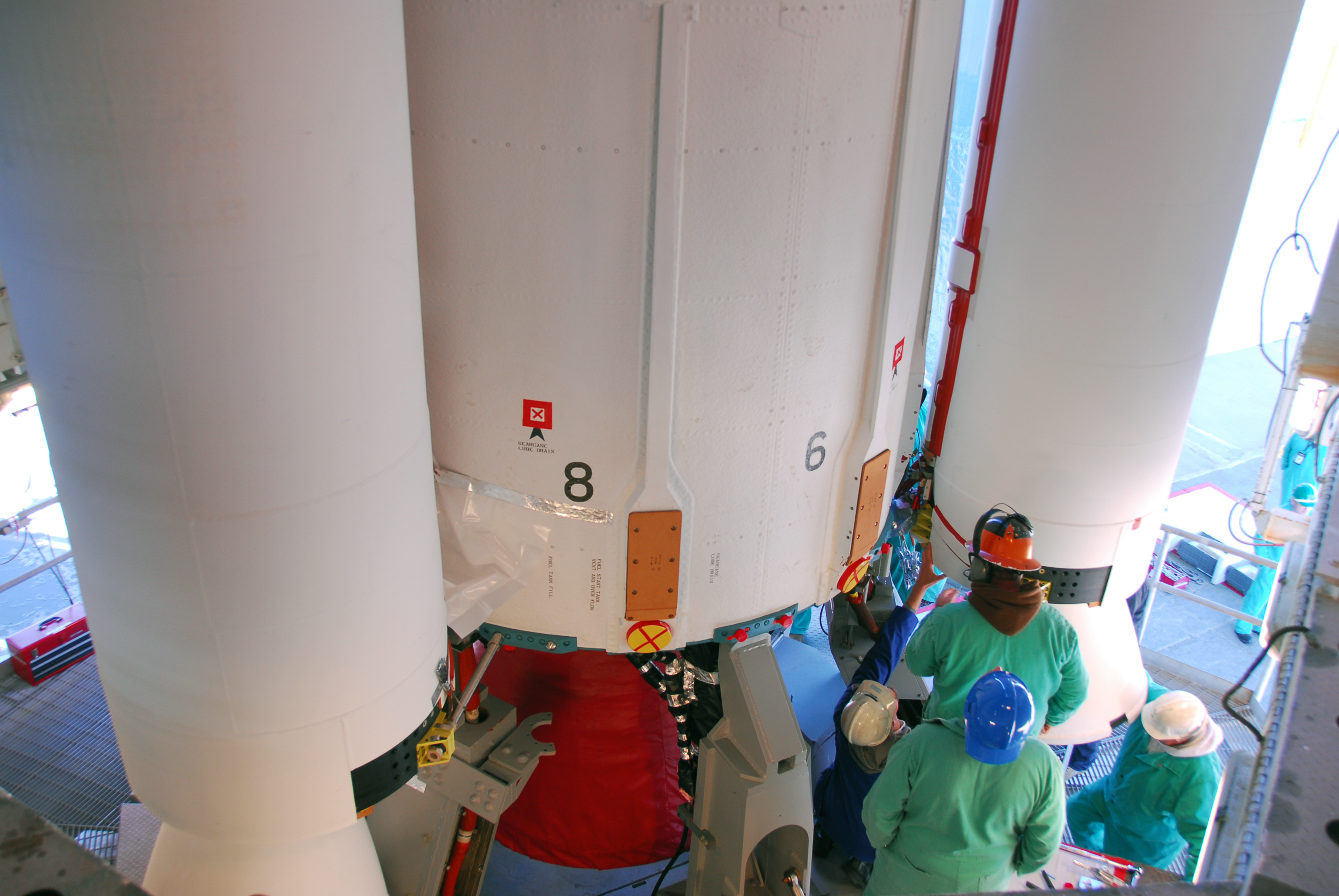 Attaching sold rocket booster to the Dlta II 7320-10C