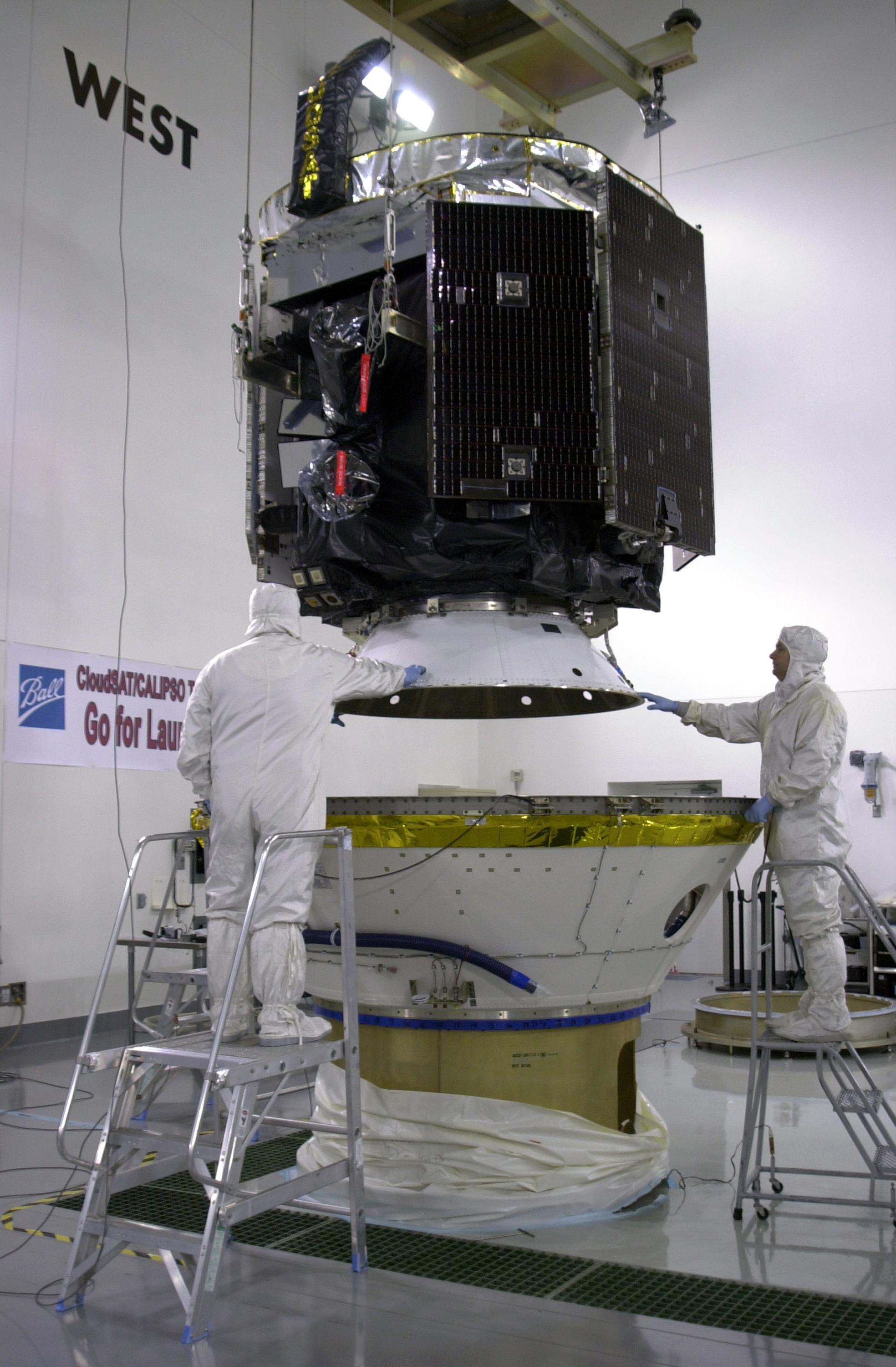 CloudSat is lowered into the lower part of the dual-payload attach fitting