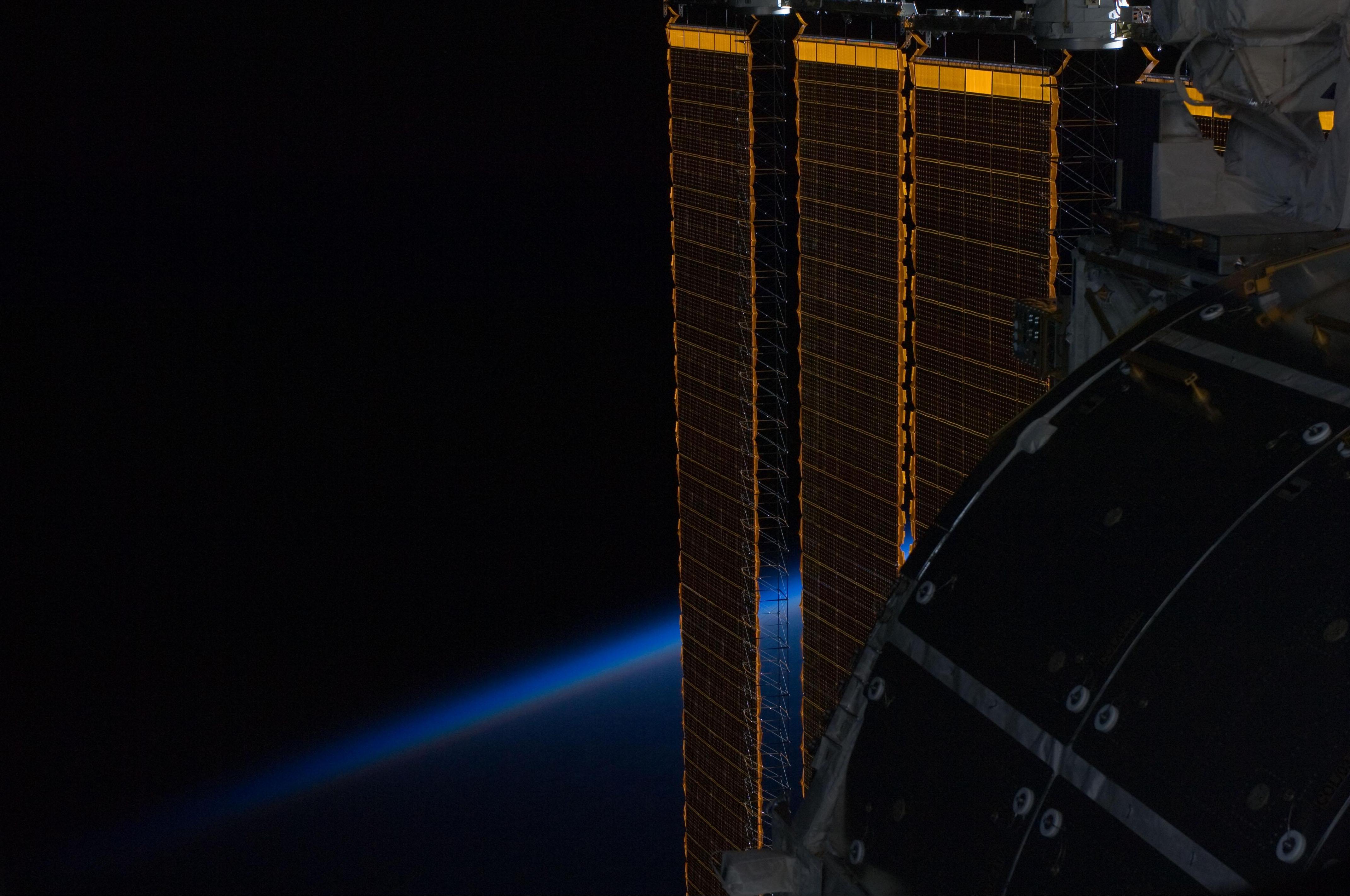 ISS solar panel intersecting Earth's horizon