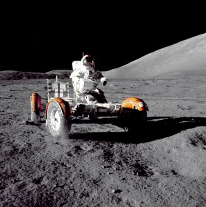 Astronaut Eugene A. Cernan, Apollo 17 mission commander, makes a short checkout of the Lunar Roving Vehicle during the early part of the first Apollo 17 extravehicular activity (EVA-1) at the Taurus-Littrow landing site. This view of the 