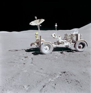 The Lunar Roving Vehicle is photographed alone against the lunar background during the Apollo 15 lunar surface extravehicular activity (EVA) at the Hadley-Apennine landing site. This view is looking north. The west edge of Mount Hadley is at the upper right edge of the picture.Mount Hadley is at the upper right edge of the picture. It rises approximately 4,500 meters (about 14,765 feet) above the plain. The most distant lunar feature visible is approximatley 25 kilometers (about 15.5 statute miles) away.