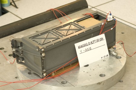 Marshall and Cal Poly technicians wired the NanoSail-D spacecraft to accelerometers, instruments which measure vibration response during simulated launch conditions.