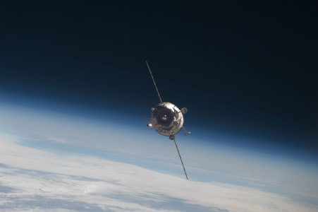 Backdropped by Earth's horizon and the blackness of space, the new unpiloted Russian Mini-Research Module 2 (MRM2), also known as Poisk, approaches the International Space Station. The MRM2 docked to the space-facing port of the Zvezda Service Module at 9:41 a.m. (CST) on Nov. 12, 2009. It began its trip to the station when it was launched aboard a Soyuz rocket from the Baikonur Cosmodrome in Kazakhstan on Nov. 10. Poisk is a Russian term that translates to search, seek and explore. It will provide an additional docking port for visiting Russian spacecrafts and will serve as an extra airlock for spacewalkers wearing Russian Orlan spacesuits. Poisk joins a Russian Progress resupply vehicle and two Russian Soyuz spacecraft currently docked at the station.