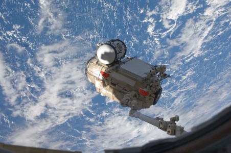 S132-E-008114 (18 May 2010) --- In the grasp of the Canadarm2, the Russian-built Mini-Research Module 1 (MRM-1) is transferred from space shuttle Atlantis' payload bay to be permanently attached to the Earth-facing port of the Zarya Functional Cargo Block (FGB) of the International Space Station. Named Rassvet, Russian for 