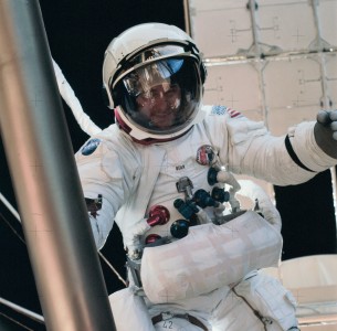 Astronaut Alan L. Bean, Skylab 3 commander, participates in the final Skylab 3 extravehicular activity, during which a variety of tasks were performed. Here, Bean is near the Apollo Telescope Mount (ATM) during final film change out for the giant telescope facility. Astronaut Owen K. Garriott, who took the picture, is reflected in Bean's helmet visor. The reflected Earth disk in Bean's visor is so clear that the Red Sea and Nile River area can delineated. Original was labeled CX-27. Camera Data: 70mm Hasselblad; Lens 100mm; Film Type: S0-368 Medium Speed Ektachrome.