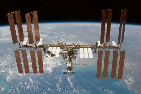 Backdropped by Earth's horizon and the blackness of space, the International Space Station is featured in this image photographed by an STS-130 crew member on space shuttle Endeavour after the station and shuttle began their post-undocking relative separation. Undocking of the two spacecraft occurred at 7:54 p.m. (EST) on Feb. 19, 2010.