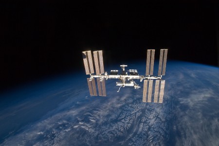 Backdropped by Earth's horizon and the blackness of space, the International Space Station is featured in this image photographed by an STS-131 crew member on space shuttle Discovery after the station and shuttle began their post-undocking relative separation. Undocking of the two spacecraft occurred at 7:52 a.m. (CDT) on April 17, 2010.