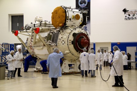 In the Astrotech payload processing facility at Port Canaveral, Fla., preparations are under way to place the Russian-built Mini-Research Module-1, or MRM-1, into the transportation container in which it will be moved to the Space Station Processing Facility at NASA's Kennedy Space Center. The six-member crew of space shuttle Atlantis' STS-132 mission will deliver an Integrated Cargo Carrier and the MRM-1, known as Rassvet, to the International Space Station. The second in a series of new pressurized components for Russia, MRM-1 will be permanently attached to the Earth-facing port of the Zarya control module. Rassvet, which translates to 