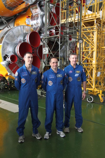 Soyuz TMA-22 crew in front of their booster rocket