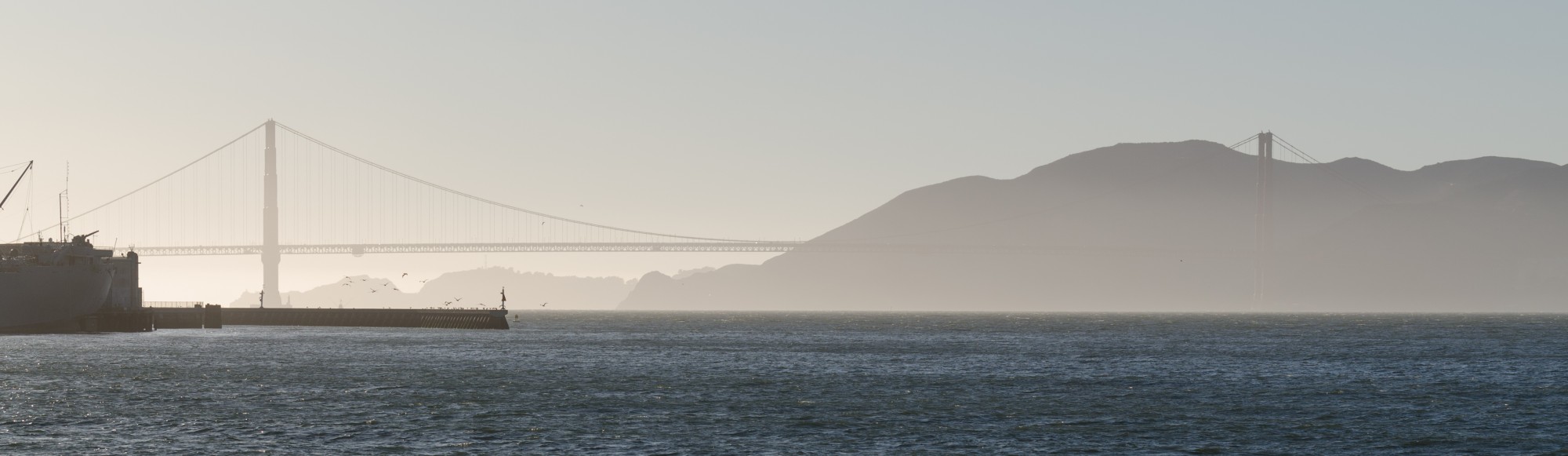 Golden Gate Bridge in fog from Pier 39 2013
