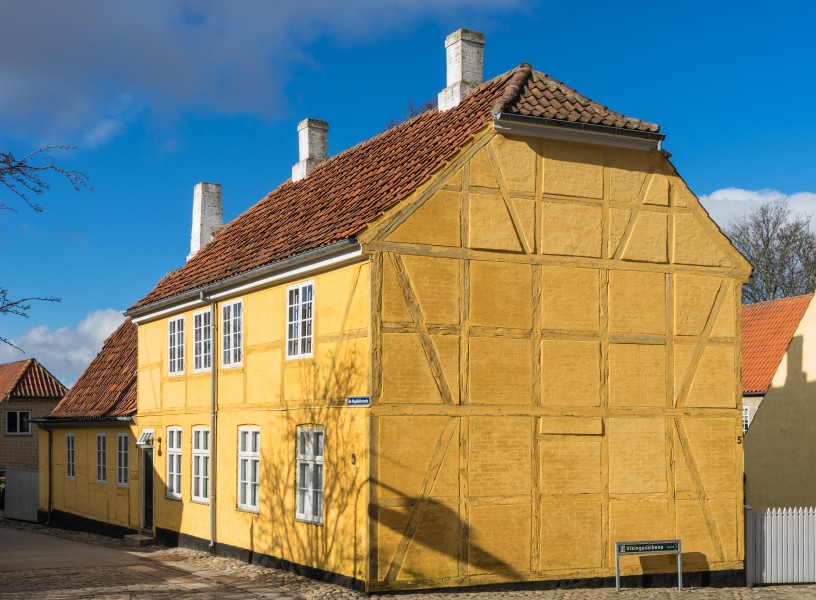 Yellow timber frammed house Roskilde cathedral square Denmark