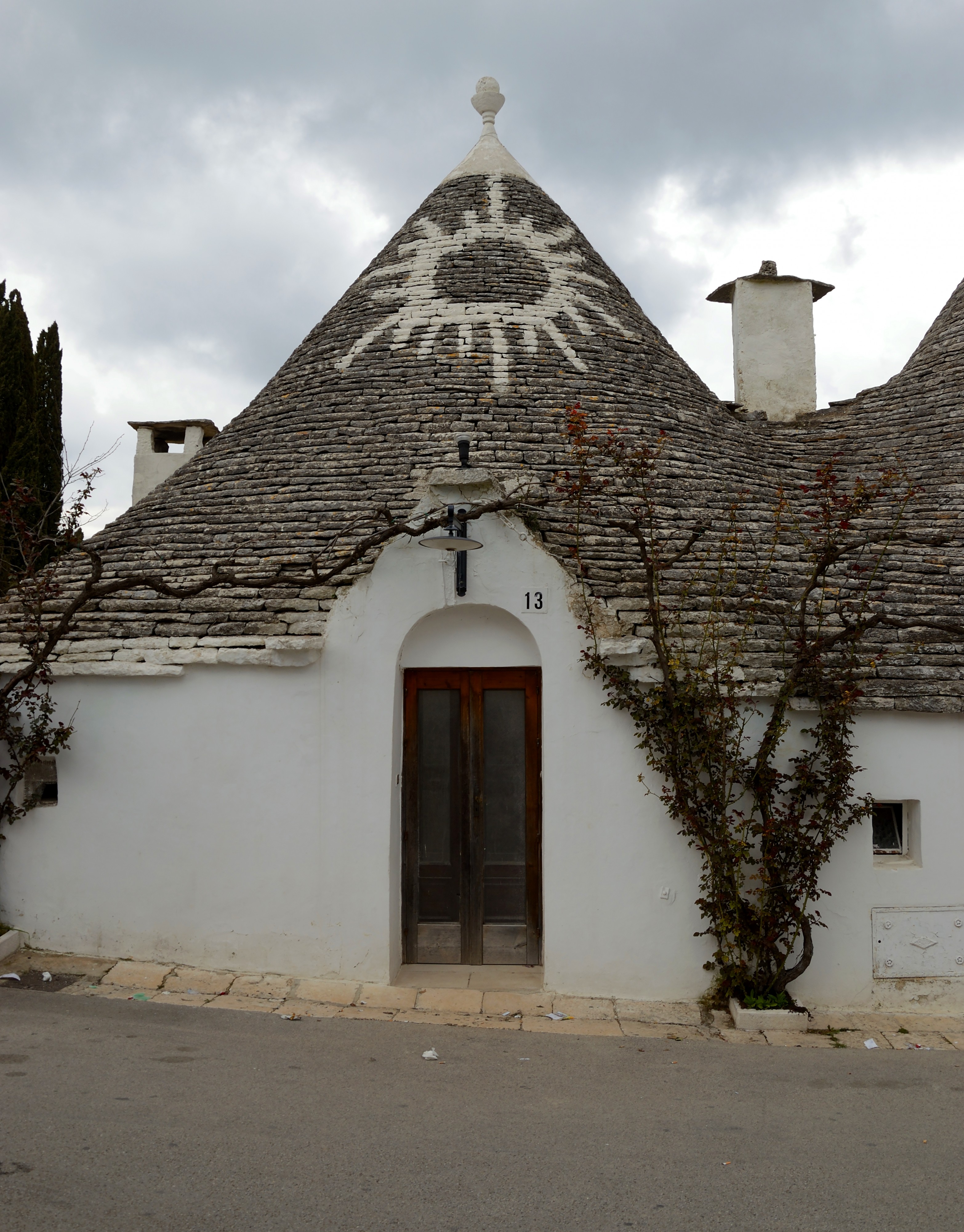 Trullo with sign in Alberobello