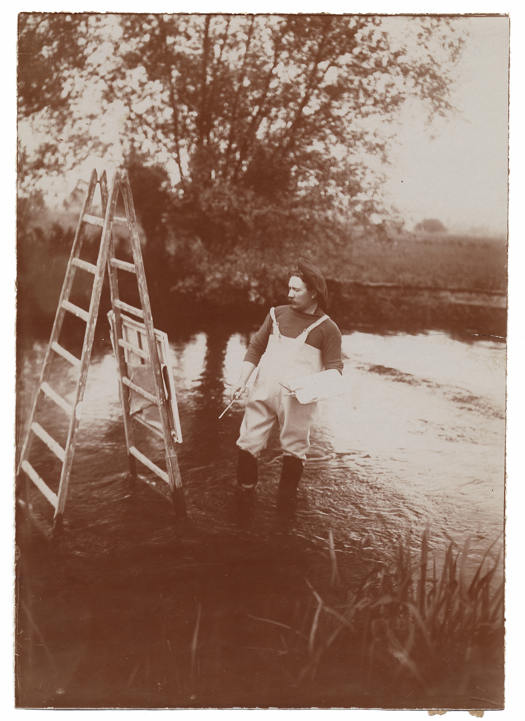 Description- Knight wearing high water boots standing in water and painting at an easel. Identification on verso (handwritten)- Louis Aston Knight; Smith, F.H; The Man in the High-Water Boots. (2545775280)
