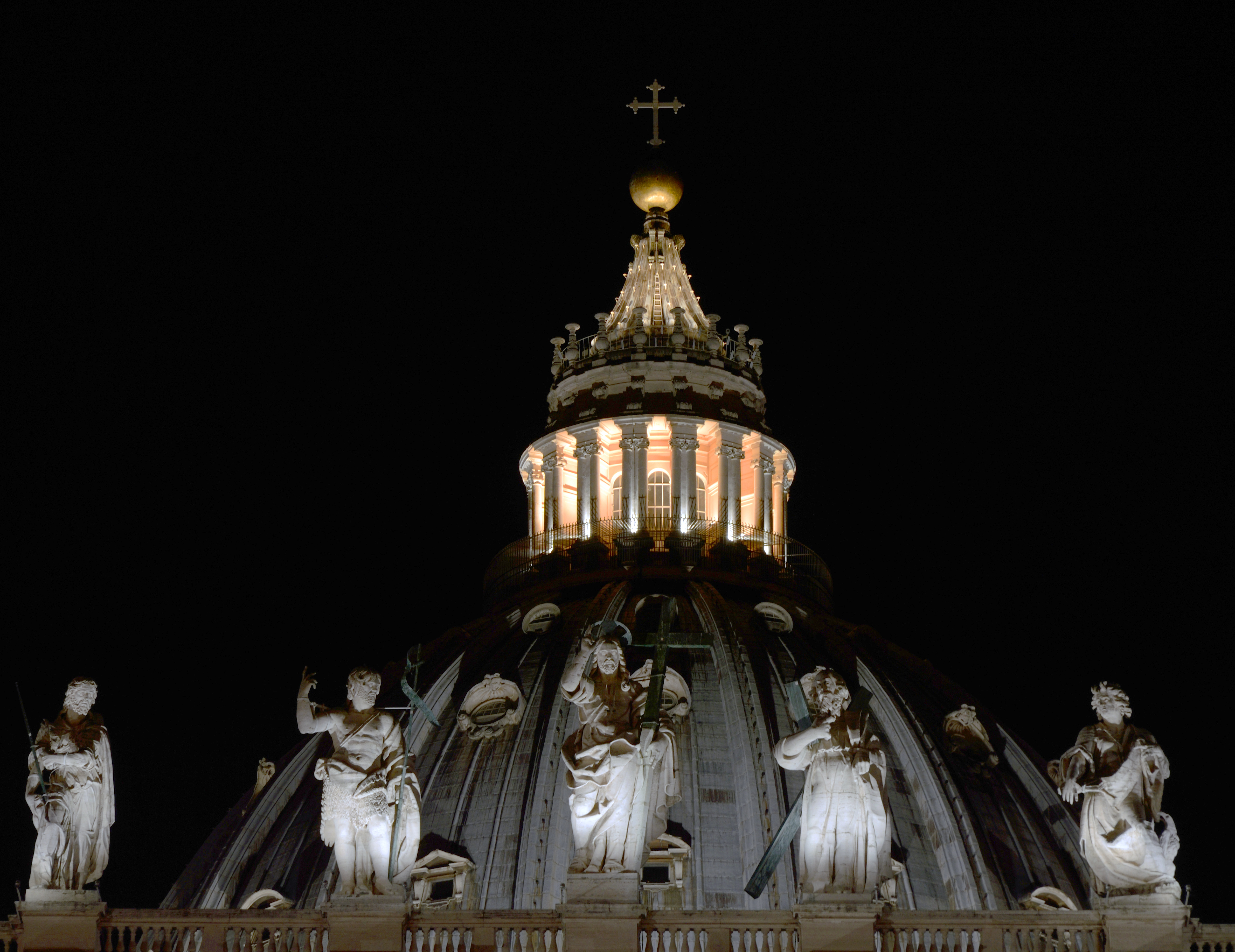 Dome of St. Peter and statues at night