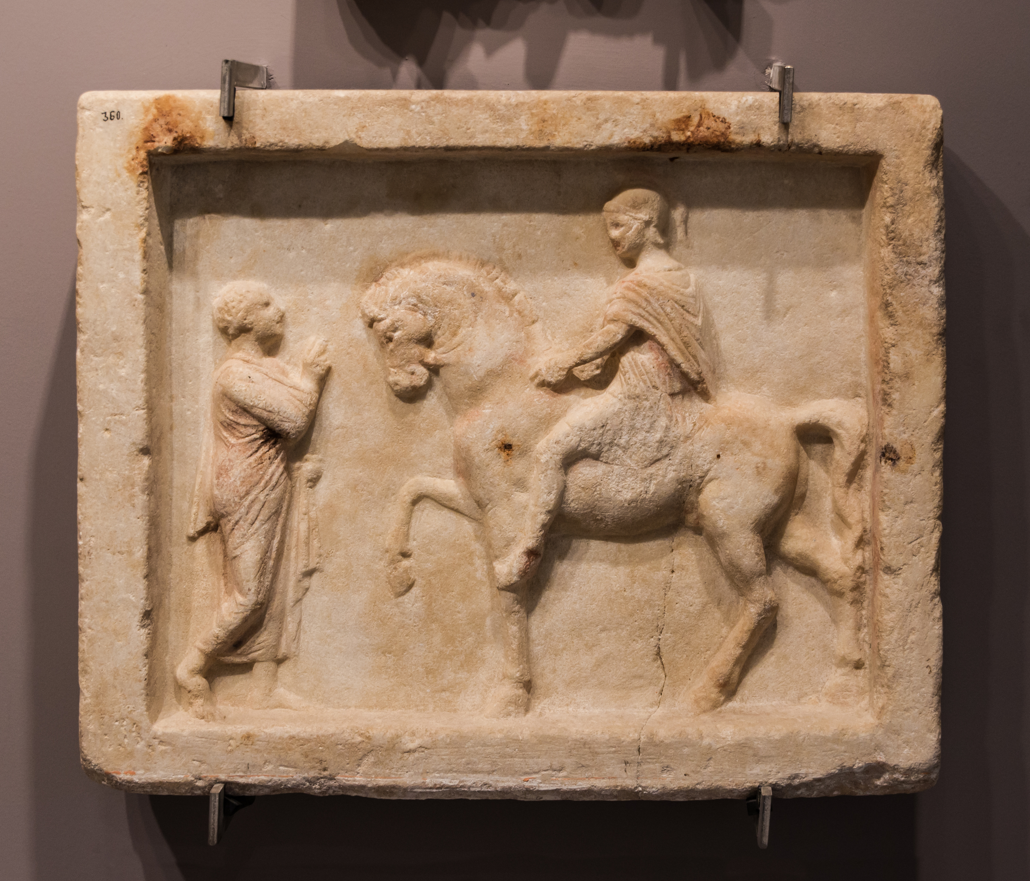 Marble plaque Romans discussing archmus Heraklion
